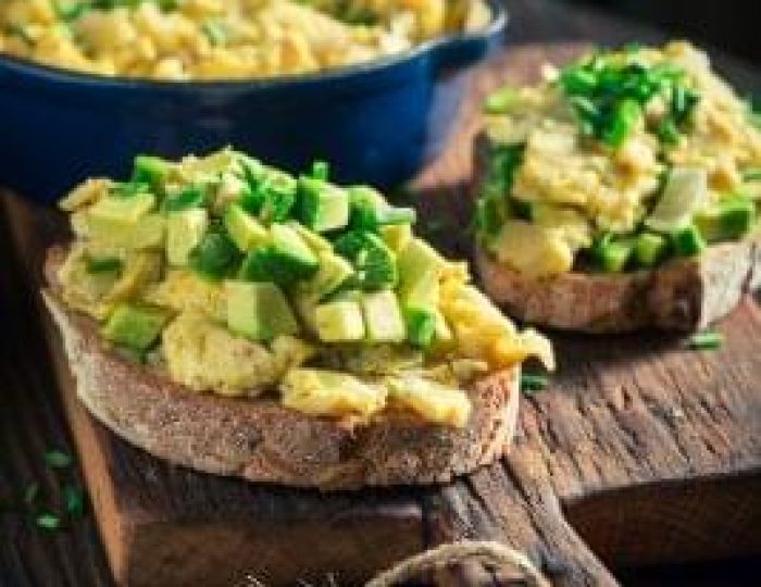 Homemade-scrambled-eggs-with-avocado-for-breakfast