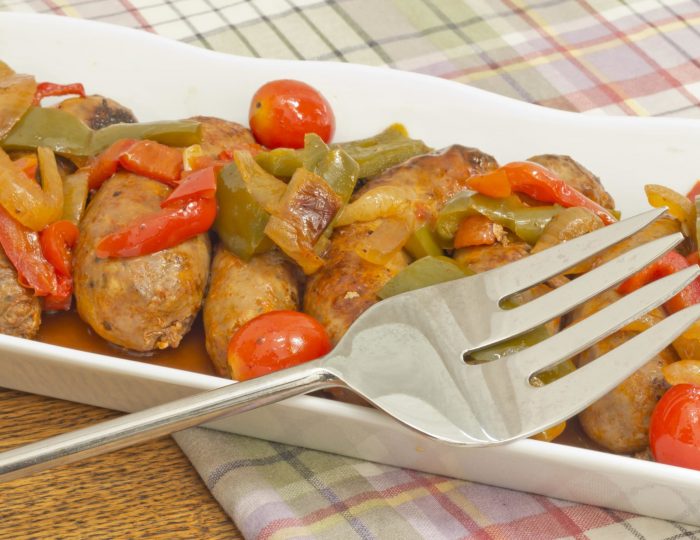 Hot grilled italian sausage with sliced peppers and onions