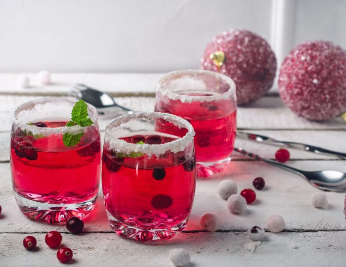 Cranberry drink in a glass and berries, sangria.
